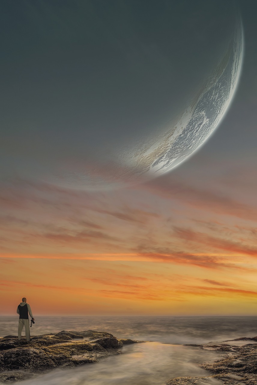 shoreline with moon in the sky